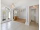 Bright foyer boasts tile floors, arched entryways, and an open floor plan leading to the dining room at 4412 Caliquen Dr, Brooksville, FL 34604