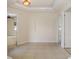 Large foyer with decorative wall cut-out and tile floors at 4412 Caliquen Dr, Brooksville, FL 34604