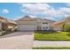 Charming one-story home with a brick driveway and well-maintained landscaping at 4412 Caliquen Dr, Brooksville, FL 34604