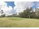Expansive golf course featuring rolling green hills and mature trees at 4412 Caliquen Dr, Brooksville, FL 34604
