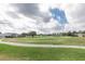 Scenic golf course view featuring lush green grass and a clear path winding through the manicured landscape at 4412 Caliquen Dr, Brooksville, FL 34604
