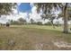 Picturesque golf course with a clear path, mature trees, and lush green grass at 4412 Caliquen Dr, Brooksville, FL 34604