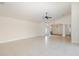 Expansive living room with tile flooring, high ceilings, neutral paint, and abundant natural light at 4412 Caliquen Dr, Brooksville, FL 34604