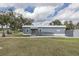 Charming exterior of Hernando Oaks Grill featuring a ramp, well-kept lawn, and double doors at 4412 Caliquen Dr, Brooksville, FL 34604