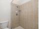 Tiled shower with neutral-colored tiles and modern fixtures at 4412 Caliquen Dr, Brooksville, FL 34604