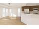 Bright living space featuring a breakfast bar and views from the large windows and sliding glass doors at 5015 Us Highway 19 # 108, New Port Richey, FL 34652