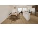 Open-concept living space with a dining area flowing into the kitchen and living room at 5015 Us Highway 19 # 508, New Port Richey, FL 34652
