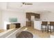 Open-concept living room and kitchen space with island seating and modern stainless appliances at 5015 Us Highway 19 # 508, New Port Richey, FL 34652