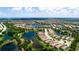 An aerial view of a home nestled in a community near a scenic lake at 5352 Vaccaro Ct, Bradenton, FL 34211