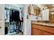 Walk-in closet with custom shelving and hanging storage at 5352 Vaccaro Ct, Bradenton, FL 34211