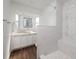 Modern bathroom features white cabinets, vessel sink, decorative shower, and ample natural light at 5830 34Th N Ave, St Petersburg, FL 33710