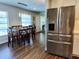 A modern dining area with a wood table and chairs is adjacent to an updated kitchen at 5830 34Th N Ave, St Petersburg, FL 33710