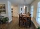 Inviting dining room with wood table, pendant lighting, and seamless access to other living areas at 5830 34Th N Ave, St Petersburg, FL 33710