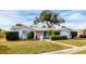 Beautiful single-story light blue home with well-maintained landscaping and a cozy, welcoming appeal at 5830 34Th N Ave, St Petersburg, FL 33710