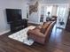 Spacious living room featuring a plush rug, TV, and sliding doors to another area of the home at 5830 34Th N Ave, St Petersburg, FL 33710