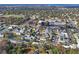 Aerial view of the community, showcasing mature trees and convenient access to commercial areas at 6028 Wilds Dr # 6A, New Port Richey, FL 34653