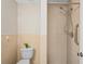 Bathroom featuring neutral tiled walls, walk-in shower and grab bar at 6028 Wilds Dr # 6A, New Port Richey, FL 34653