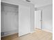 Bedroom featuring closet, and view to open doorway at 6028 Wilds Dr # 6A, New Port Richey, FL 34653