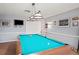 Spacious game room with pool table, TV, and neutral decor for entertainment at 6028 Wilds Dr # 6A, New Port Richey, FL 34653