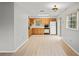 Eat in kitchen with traditional cabinets and a sliding glass door at 6028 Wilds Dr # 6A, New Port Richey, FL 34653