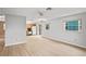 Large living room with an open layout, ceiling fan, and modern flooring at 6028 Wilds Dr # 6A, New Port Richey, FL 34653