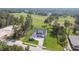 An aerial view of the house with its well-manicured lawn and brick driveway on a golf course at 6452 Summit View Dr, Brooksville, FL 34601