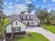 Stunning two-story home with lush landscaping and a paver driveway at 6452 Summit View Dr, Brooksville, FL 34601