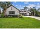 Charming home with manicured lawn and elegant brick driveway on a sunny day at 6452 Summit View Dr, Brooksville, FL 34601