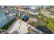 Aerial view of waterfront home with private boat dock and canal access at 6613 Josie Ln, Hudson, FL 34667