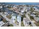 Aerial view of a two-story home with a private dock and canal access in a waterfront community at 6613 Josie Ln, Hudson, FL 34667