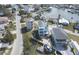 Aerial view showcasing a canal-front home with a private dock and boats, set in a residential area at 6613 Josie Ln, Hudson, FL 34667