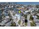 Aerial view of a two-story home situated on a canal, surrounded by other waterfront properties at 6613 Josie Ln, Hudson, FL 34667