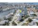 Aerial view of a canal front property in a waterfront neighborhood, highlighting the boat dock at 6613 Josie Ln, Hudson, FL 34667