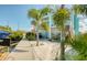 Backyard featuring boat lift, picnic area, and coastal landscaping on a waterfront property at 6613 Josie Ln, Hudson, FL 34667