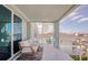 Enjoy the waterfront view from the balcony with outdoor seating and a spiral staircase at 6613 Josie Ln, Hudson, FL 34667