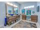 Stylish bathroom featuring a double vanity, unique bowl sinks, and a separate makeup area at 6613 Josie Ln, Hudson, FL 34667