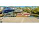Waterfront property boasts a private boat dock with boat lift and space for multiple boats at 6613 Josie Ln, Hudson, FL 34667