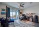 Bright and airy office with a view overlooking the water and a plush blue couch at 6613 Josie Ln, Hudson, FL 34667