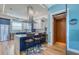 Kitchen with island seating and an elevator, enhancing convenience and accessibility at 6613 Josie Ln, Hudson, FL 34667