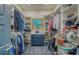 Organized walk-in closet with ample shelving, hanging space, and a central storage unit at 6613 Josie Ln, Hudson, FL 34667