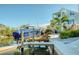Waterfront property with a boat dock, lift, and outdoor picnic area perfect for entertaining at 6613 Josie Ln, Hudson, FL 34667