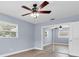 Bedroom featuring a sliding closet door, neutral walls, and a window at 686 Manor W Dr, Dunedin, FL 34698