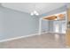An open dining area with light tile flooring and a view to the backyard at 686 Manor W Dr, Dunedin, FL 34698