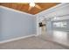 Back living area with view to kitchen and dining room featuring an open floor plan at 686 Manor W Dr, Dunedin, FL 34698