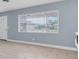 Living room showcasing a window with horizontal blinds at 686 Manor W Dr, Dunedin, FL 34698