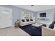 The living room features a dark blue area rug and a large picture window at 686 Manor W Dr, Dunedin, FL 34698