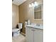 Bathroom featuring a toilet, vanity and modern fixtures at 7109 Kirsch Ct # 2, New Port Richey, FL 34653