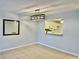 Dining room featuring neutral walls, a decorative mirror and access to kitchen at 7109 Kirsch Ct # 2, New Port Richey, FL 34653