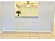 View of the dining room featuring an open serving hatch to the kitchen at 7109 Kirsch Ct # 2, New Port Richey, FL 34653