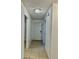Entrance hallway featuring neutral paint, tile floors, and decorative lighting at 7109 Kirsch Ct # 2, New Port Richey, FL 34653